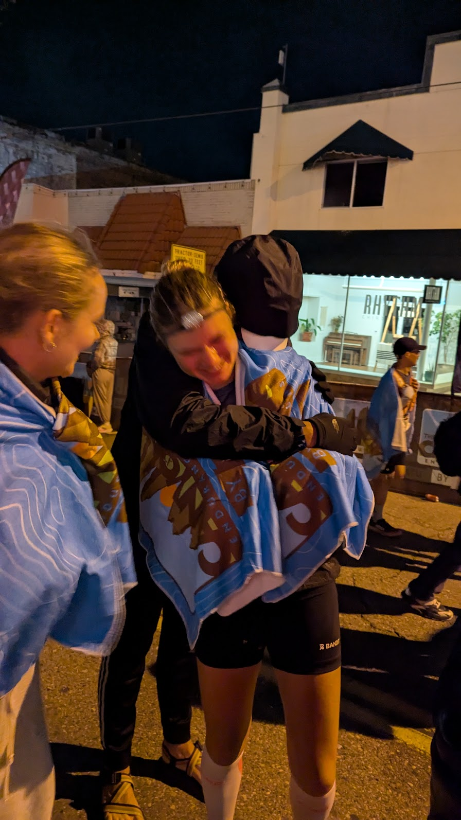 Max and Eliza hugging after Canyons 100K